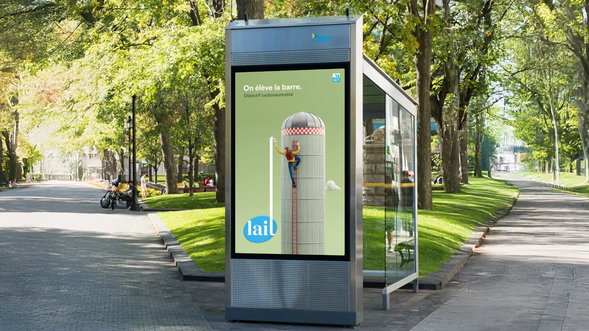 Bus shelter ad: a clay farmer climbing a silo, with the lait logo